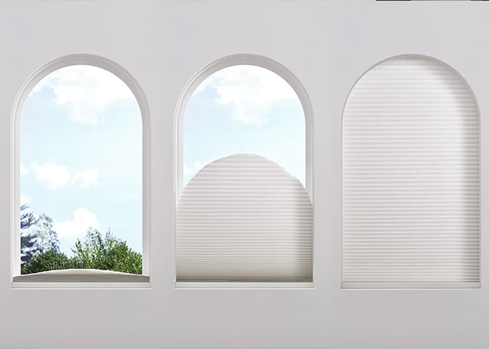 Bright arched windows with white blinds and outdoor view, creating a stylish, airy ambiance ideal for contemporary interiors.
