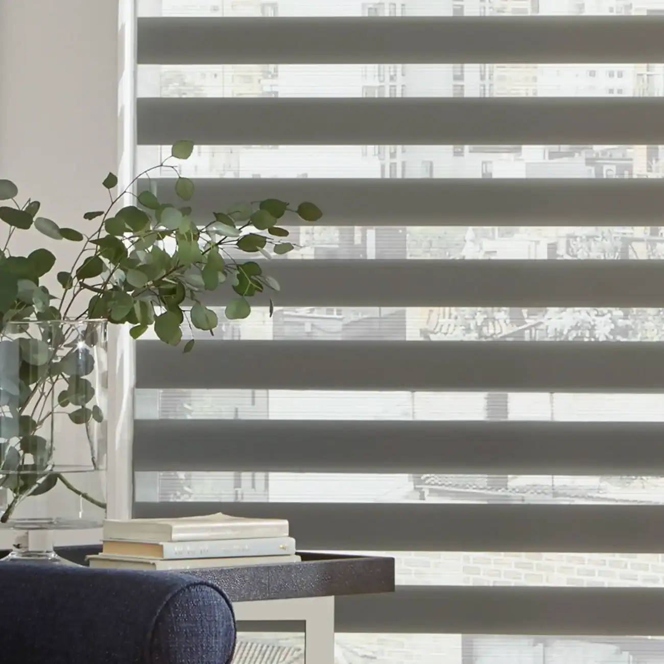 Bright window blinds with cityscape view, natural light in a contemporary interior.