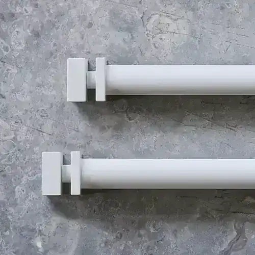 Elegant white curtain rods suitable for contemporary home decor.