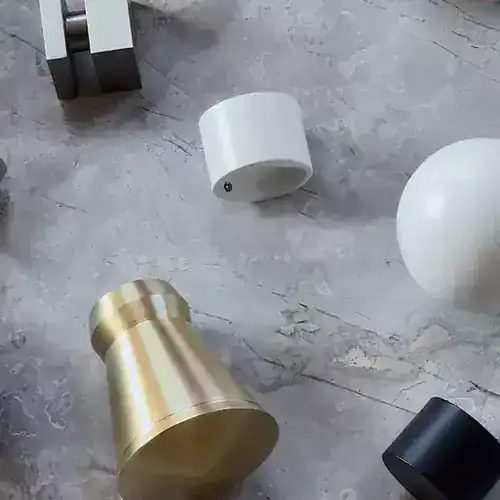 Elegant metallic and ceramic vases in various shapes and colors.