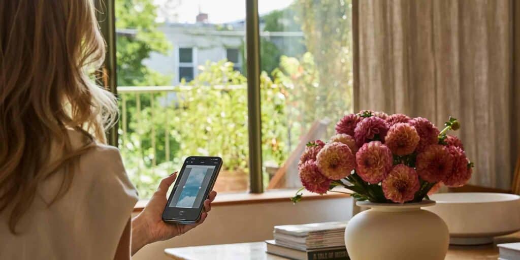 Modern Powerview® motorized drapery system operated via smartphone, providing seamless window treatment automation for enhanced comfort and convenience.