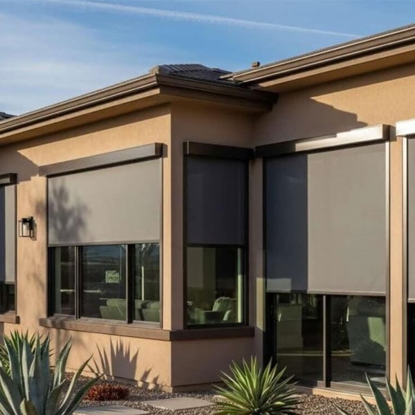 Contemporary house featuring large energy-efficient windows with roller shades, enhancing insulation and reducing energy consumption.